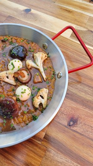 Arroz meloso con setas y coliflor ahumada at D'mentes Café Bistró in Santiago