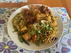 A platter of Chickpeas, noodles, salad, bbq vegan nuggets, potato, and string beans .  at The Vegan Spot in Charlestown