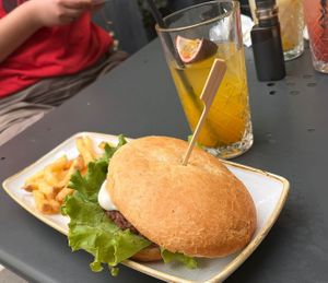 Vegan burger with fries and mango lemonade at Brunch Republic  in Padua