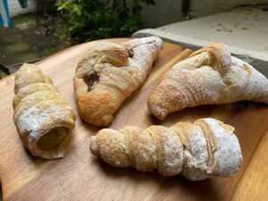 Pistachio and nutella croissants, and chocolate and pistachio cannoli at Take A Bite And Smile in London