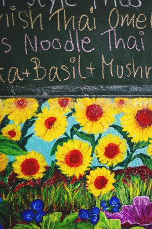 The colourfufl chalkboard menu  at Anchan Vegetarian Restaurant in Chiang Mai