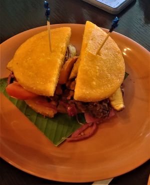 El Vegano in Corn Tortilla  (sandwich) - Corn Tortilla with sweet plantain (tajada), black beans, grilled carrots & tomatoes & pickled onion at El Trapiche - Albrook Mall in Panama City