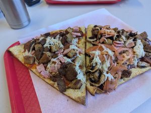Vegan meatzza on the right and Vegan BBQ chicken on the right at Bizza in San Mateo