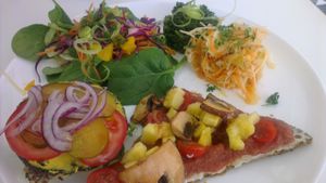 mixed plate including pizza slice and burger at Pure on Raw in Sheffield