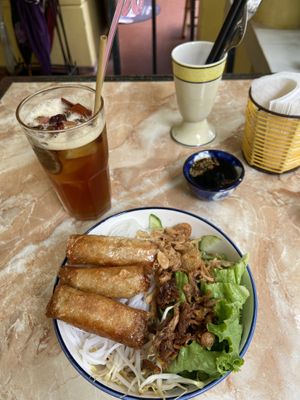 Noodles with spring rolls/orange cinnamon tea  at The Garden Cafe & Vegetarian Food in Hue