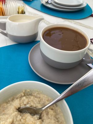 Vegan Porridge and strong coffee  at Taste & Time Cafe in Abu Dhabi
