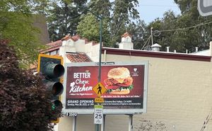 Billboard advertising grand opening across from the restaurant  at Better Chew Kitchen - Vallejo in Vallejo