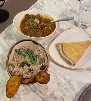 Jerk goat, rice and beans, fried plantainn  at Meat The Vegans in North West London