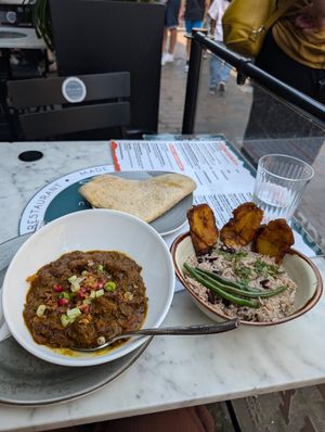 Vegan goat curry - comes with all this! at Meat The Vegans in North West London