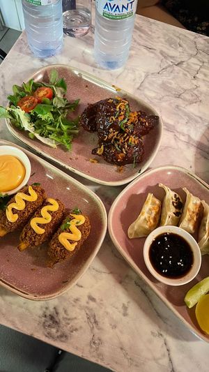 Bbq "chicken" wings (top), gyoza and jackfruit drumsticks at Meat The Vegans in North West London