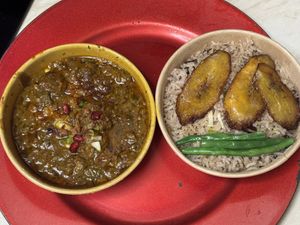 Curry goat with rice & peas  at Meat The Vegans in North West London