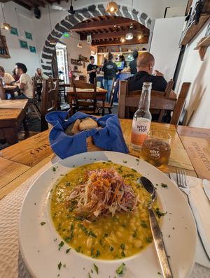 Vegan feijoada with bread and peach ginger soda. Pretty tasty and huge portion! at A Tasca in Sao Miguel