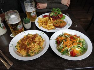 Kässspatzle, salad and burger with fries at Mathilda Vegan in Munich