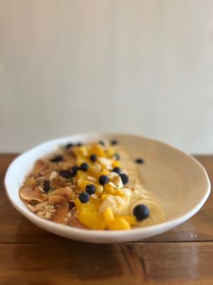 Yogurt de coco con granola y fruta de invierno.  at Vegan Clan in Santa Cruz