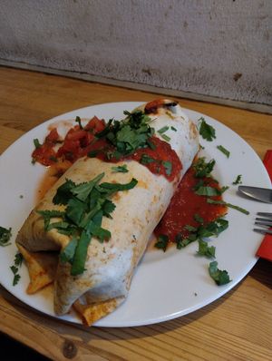 Vegan Burrito with potatoes, beans, guacamole, tomatoes and coriander and at Kombuse in Hamburg
