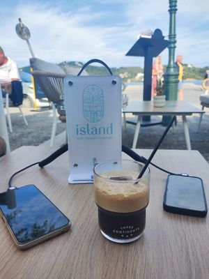 Charge your phone while wait at island cafe in Skiathos
