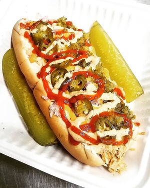 SPICY CRABBY SALAD SAMMICH, sweet and spicy crabby salad in a soft hoggi roll topped with sriracha, jalapenos, sweet relish, crispy onions, and sweet n sour mayo. at Mad Munchies in Pensacola