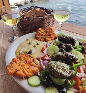 Full vegan menu: moussaka,dolmadakia, fried santorini tomato balls, fava, eggplant salad, local wine. at Santorini Island Tour in Santorini