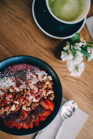 Smoothie bowl. Seasonal local organic berries, homemade nut milk, kefir.  Topping - homemade granola, seasonal berries, chia, etc. at Booch Cafe in Riga