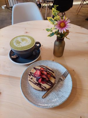 Tart and matcha latte at Booch Cafe in Riga