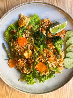 Spicy tofu fried rice with local BIO broccoli, garlic scapes and other veggies. at Booch Cafe in Riga