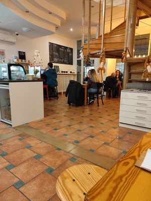 Seating area, more seating upstairs at Jádro Cafe in Brno