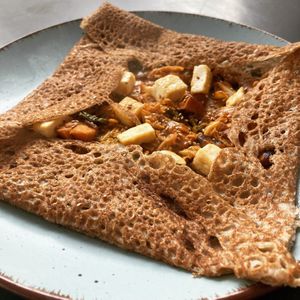 Galette with season vegetables, shiitake, fried tofu in a spicy gojuchang creamy sauce (vegan) at Planeige  in Berlin