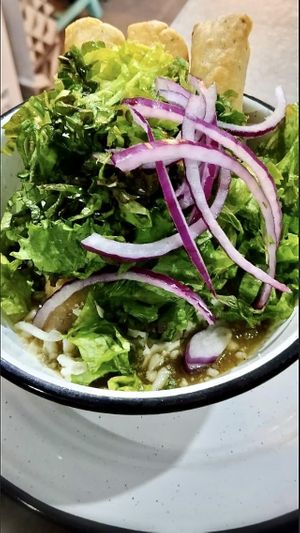 Tacos dorados rellenos de papa ahogados en salsa.  at Empathy Vegan Food in Mexico City