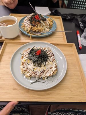 Teryiaki Okonomiyaki and plan-based tuna Okonomiyaki, with some hot tea.   at Hola Vege - 歐拉蔬食工坊 in Kaohsiung