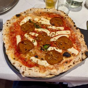 Fuoco Dolce - San Marzano Tomato, Casadei vegan mozzarella, vegan spicy salame, hot maple syrup, crispy onions, basil, & Extra-Virgin Olive Oil at Corte Campana in Stratford-upon-avon