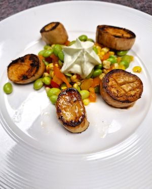 King trumpet 'scallops' over Asian-inspired succotash with wasabi espuma, for our May Day 2024 event. at Roberto's Pizza in Scranton