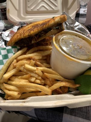 Birria melt with fries and dipping sauce   at Vegan Vatoz in Riverside