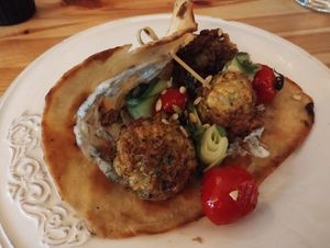 Courgette fritters, dille creme, geroosterde tomaat, komkommer, platbrood at Café Lief  in Haarlem