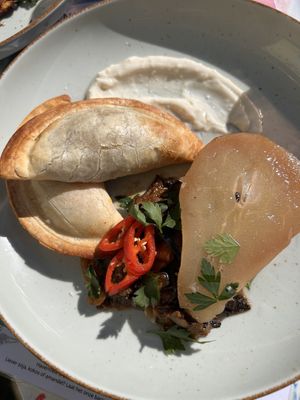 Two different type of empanadas with poached pear and chutney   at Café Lief  in Haarlem