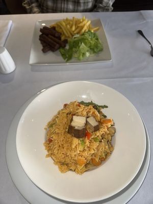 Tofu curry at the front and in the background is vepace with fries. Good vegan menu (same menu as the picture here in other reviews) visited Feb 2025. Good menu and delicious food. at Hotel Europe in Sarajevo