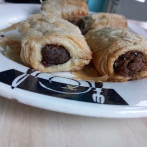 Black pudding sausage roll and haggis sausage roll. Eaten at home, but served hot from the cafe. Outdoor seating available there and in the park. at Prism Coffee in Gateshead