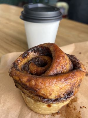 Cinnamon bun and latte  at Prism Coffee in Gateshead