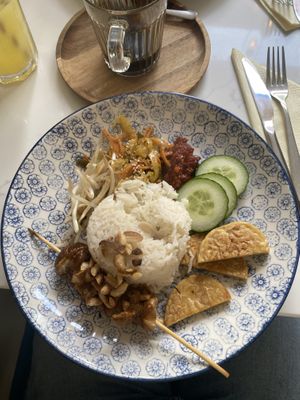 Nasi lemak: coconut rice, sambal (chilli sauce), cucumber, achar (pickled veg), peanut mushroom satay, tempeh   at Singapore Coffee House in Edinburgh