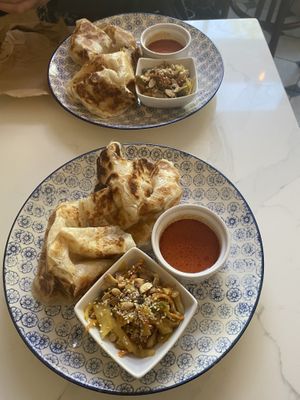 Roti canai (flaky flatbread) , achar (pickled veg), curry dipping sauce   at Singapore Coffee House in Edinburgh