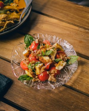 tomato salad with homemade tofu or grilled haloumi cheese and shoyu vinaigrette at POHSOP in Chiang Mai