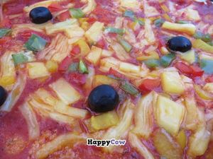 Pizza with individual topping (onions, garlic, olives) and vegan cheese at Ilse in Saarbrucken