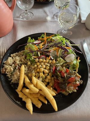 Vegan plate with quinoa taboulet, salad, ratatouille, chick peas and panisse fries  at La Récréation in Lourmarin