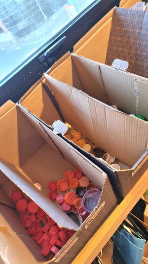 Collecting recyclables: bottle caps at Nono Shop & Cafe Seoul in Seoul