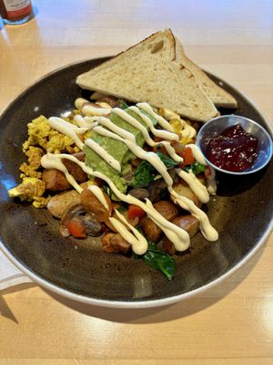 Breakfast bowl with sourdough toast  at Abode in Vancouver