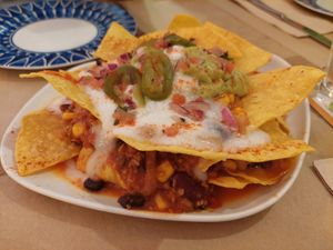 Starter / Chilaquiles (Nachos with guacamole, cheese and chili sin carne) at La Huella Vegana - Sandoval  in Madrid