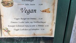 Vegan menu: burger and fries, schnitzel and salad and fries, veg patty and salad at EINKEHR zur ZAHNRADBAHN in Vienna