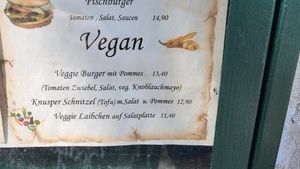Vegan menu: burger and fries, schnitzel and salad and fries, veg patty and salad at EINKEHR zur ZAHNRADBAHN in Vienna