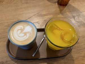 Coffee with oat milk and OJ   at Simona Specialty Coffee Club in San Sebastian