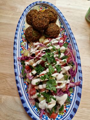 Falafel salad with hummus, tahini and parsley at FLFL - Den Haag  in The Hague