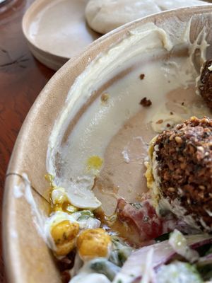 Another picture of all the hummus that is added to the falafel salad (falafel put aside for this picture)  at FLFL - Den Haag  in The Hague